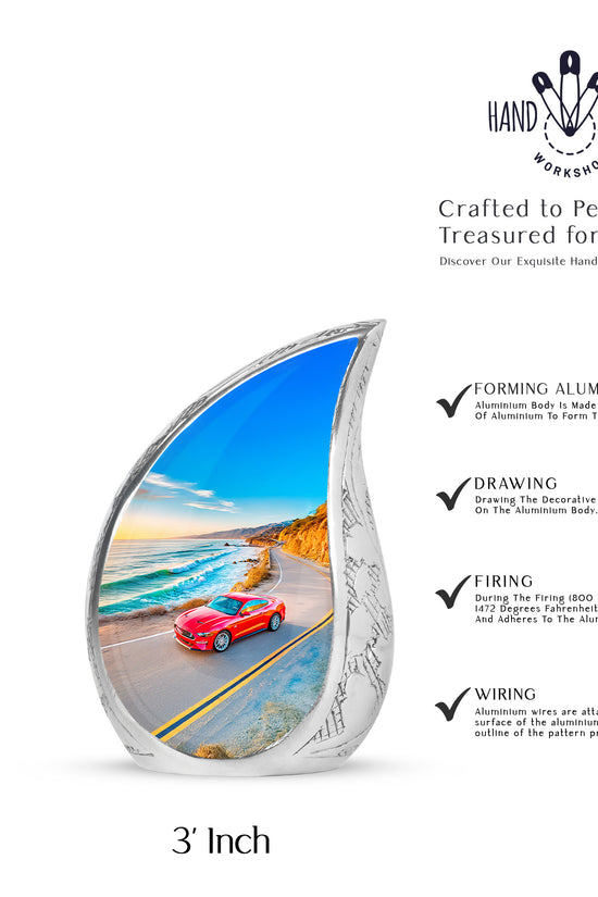 Bright Blue Car Cremation Urn angled view of lid and engraved motif - graceful tear-shaped urn with car motif - mini keepsake memorial for portion of cremation ashes