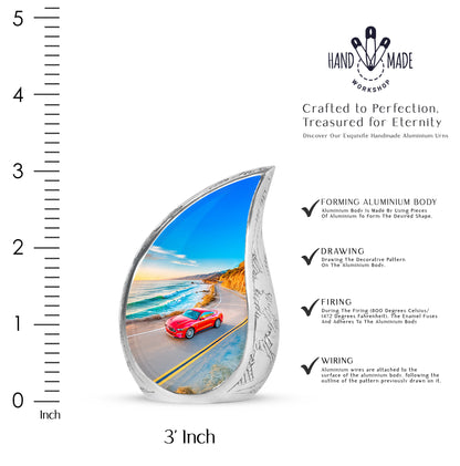 Bright Blue Car Cremation Urn angled view of lid and engraved motif - graceful tear-shaped urn with car motif - mini keepsake memorial for portion of cremation ashes