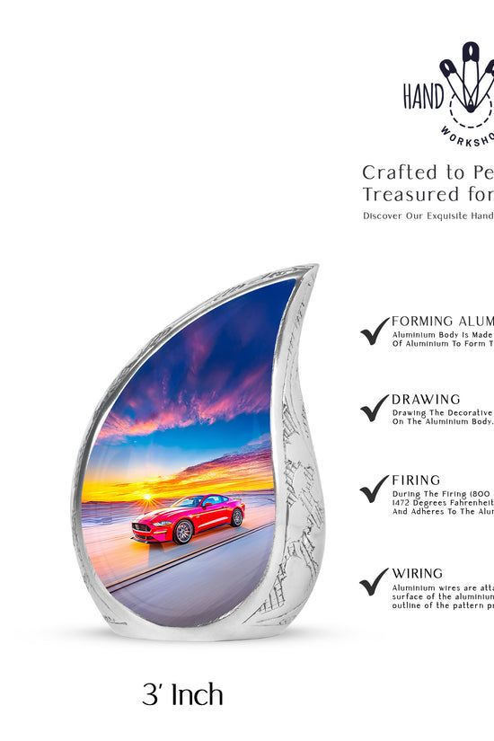 Bright Blue Car Cremation Urn angled view of lid and engraved motif - graceful tear-shaped urn with car motif - mini keepsake memorial for portion of cremation ashes