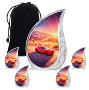 Pastel Pink Car Cremation Urn side profile showing urn shape - flowing teardrop car silhouette on curved aluminum - memorial set with one large and four small urns