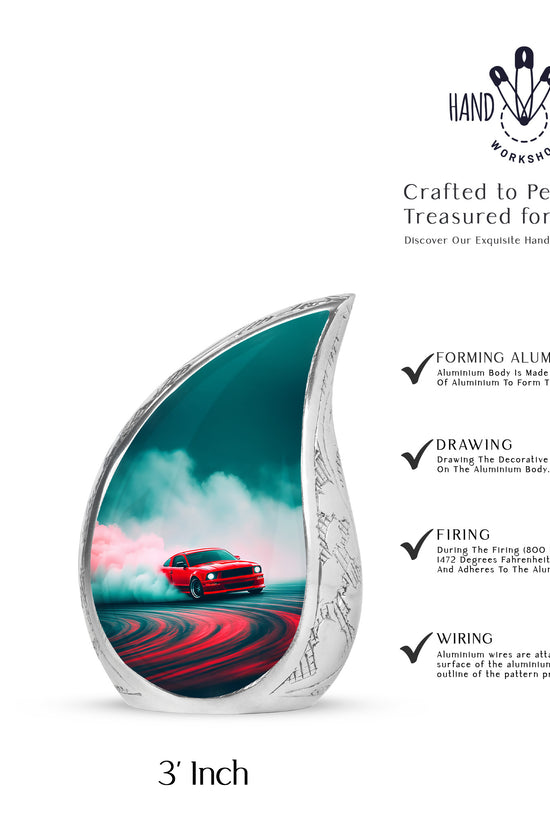Aqua Teal Car Cremation Urn angled view of lid and engraved motif - graceful tear-shaped urn with car motif - mini keepsake memorial for portion of cremation ashes