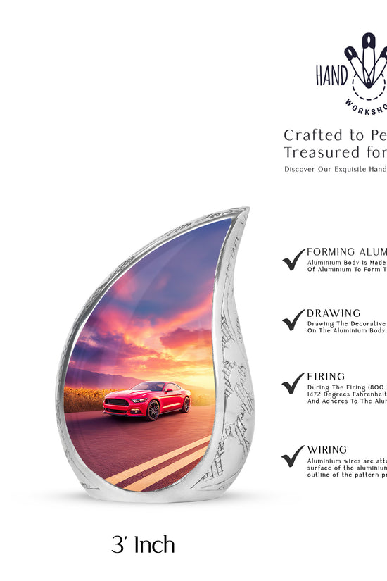 Indigo Car Cremation Urn angled view of lid and engraved motif - flowing teardrop car silhouette on curved aluminum - mini keepsake memorial for portion of cremation ashes