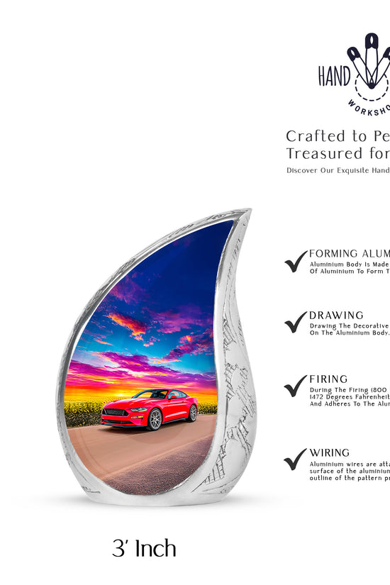 Vivid Blue Car Cremation Urn angled view of lid and engraved motif - smooth teardrop contour featuring car art - mini keepsake memorial for portion of cremation ashes