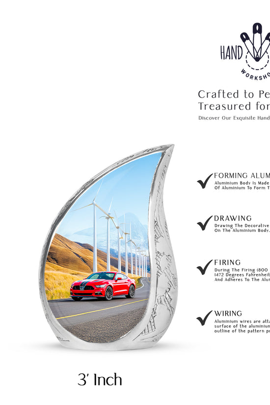 Sky Blue Car Cremation Urn angled view of lid and engraved motif - rounded teardrop car design with delicate detail - mini keepsake memorial for portion of cremation ashes