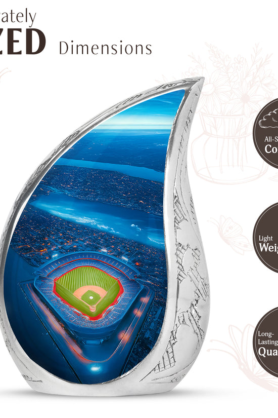 Misty Blue Baseball Cremation Urn angled view of lid and engraved motif - flowing teardrop baseball silhouette on curved aluminum - mini keepsake memorial for portion of cremation ashes