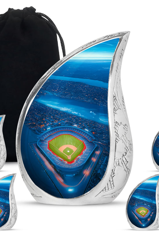 Navy Blue Baseball Cremation Urn side profile showing urn shape - flowing teardrop baseball silhouette on curved aluminum - memorial set with one large and four small urns