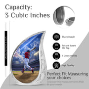 Sky Blue Baseball Cremation Urn angled view of lid and engraved motif - flowing teardrop baseball silhouette on curved aluminum - mini keepsake memorial for portion of cremation ashes