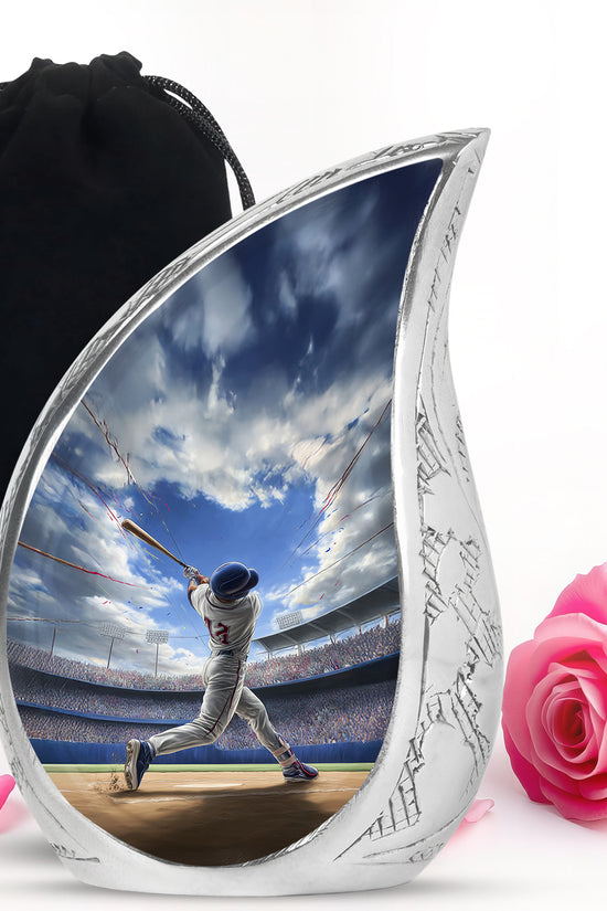 Celestial Blue Baseball Cremation Urn front view showing detailed design - flowing teardrop baseball silhouette on curved aluminum - full-size 10 inch 200 cubic inch adult cremation urn