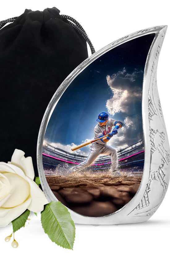 Celestial Blue Baseball Cremation Urn front view showing detailed design - flowing teardrop baseball silhouette on curved aluminum - full-size 10 inch 200 cubic inch adult cremation urn