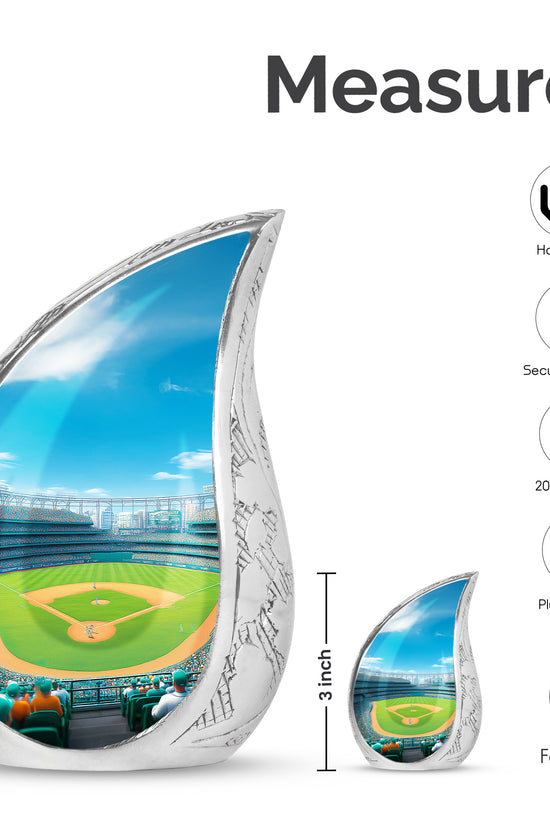 Slate Blue Baseball Cremation Urn angled view of lid and engraved motif - flowing teardrop baseball silhouette on curved aluminum - mini keepsake memorial for portion of cremation ashes