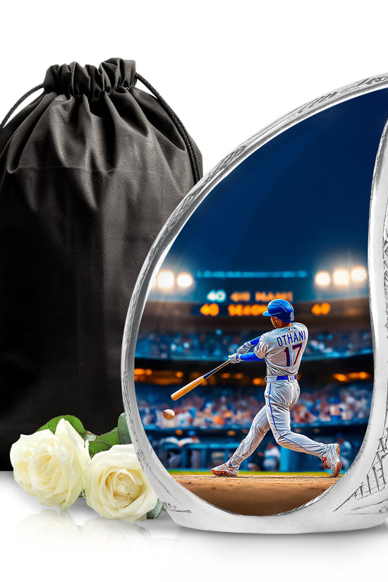 Icy Blue Baseball Cremation Urn front view showing detailed design - flowing teardrop baseball silhouette on curved aluminum - full-size 10 inch 200 cubic inch adult cremation urn