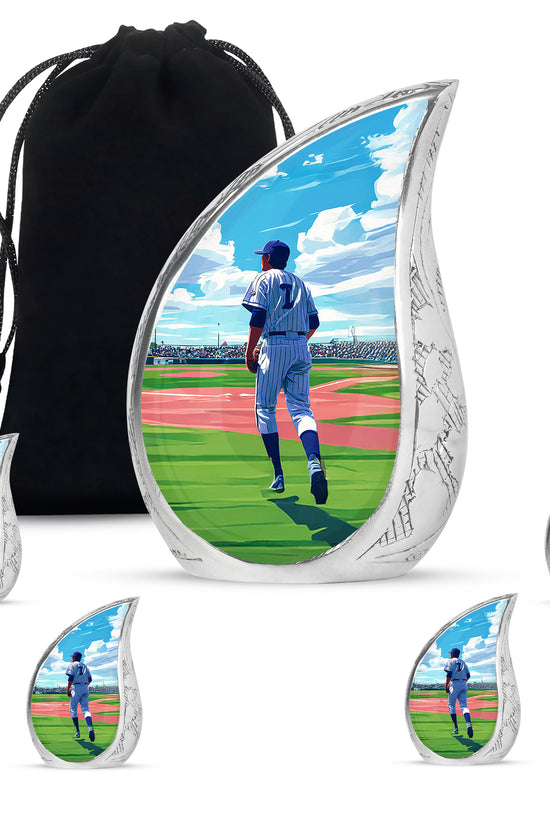 Dusty Blue Baseball Cremation Urn side profile showing urn shape - rounded teardrop baseball design with delicate detail - memorial set with one large and four small urns