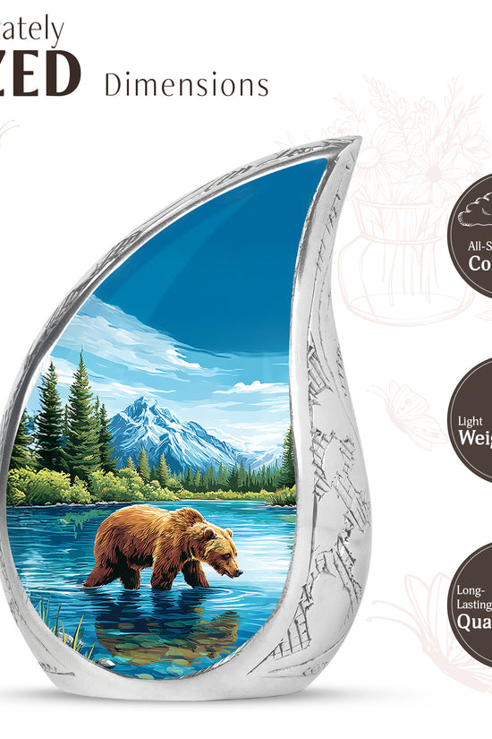 Pastel Blue Bear Cremation Urn angled view of lid and engraved motif - flowing teardrop bear silhouette on curved aluminum - mini keepsake memorial for portion of cremation ashes