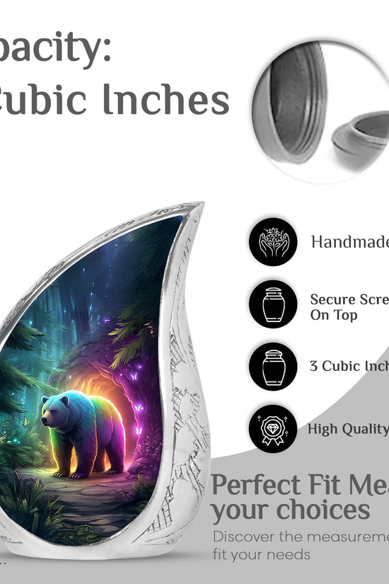 Indigo Bear Cremation Urn angled view of lid and engraved motif - flowing teardrop bear silhouette on curved aluminum - mini keepsake memorial for portion of cremation ashes