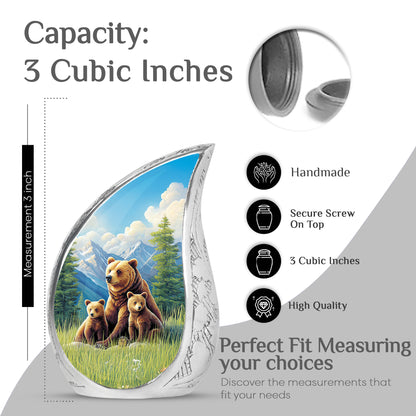 Soft Blue Bear Cremation Urn angled view of lid and engraved motif - smooth teardrop contour featuring bear art - mini keepsake memorial for portion of cremation ashes