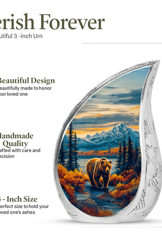 Soft Blue Bear Cremation Urn angled view of lid and engraved motif - graceful tear-shaped urn with bear motif - mini keepsake memorial for portion of cremation ashes