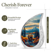 Soft Blue Bear Cremation Urn angled view of lid and engraved motif - graceful tear-shaped urn with bear motif - mini keepsake memorial for portion of cremation ashes