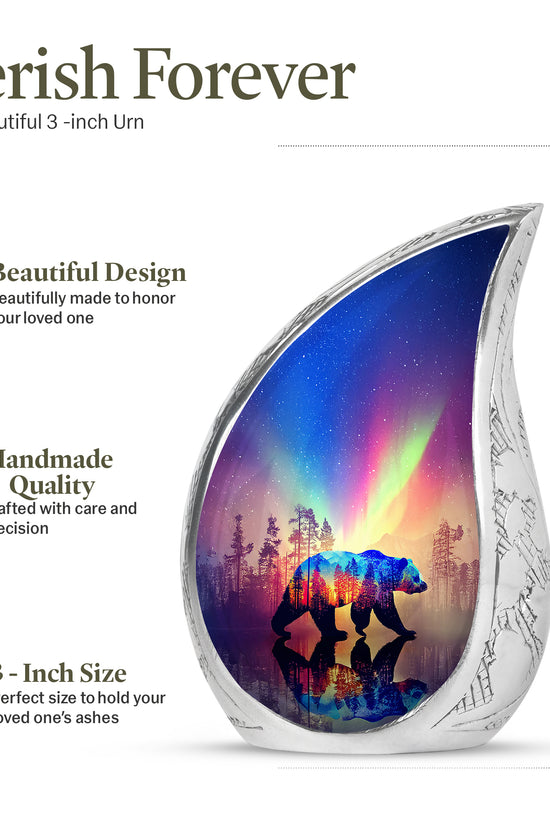 Misty Blue Bear Cremation Urn angled view of lid and engraved motif - flowing teardrop bear silhouette on curved aluminum - mini keepsake memorial for portion of cremation ashes