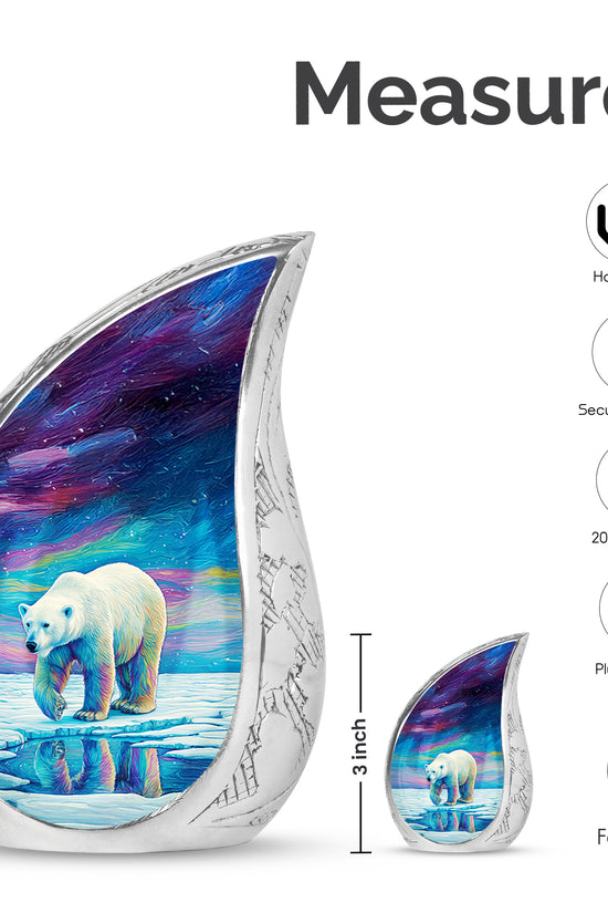 Navy Blue Bear Cremation Urn angled view of lid and engraved motif - flowing teardrop bear silhouette on curved aluminum - mini keepsake memorial for portion of cremation ashes