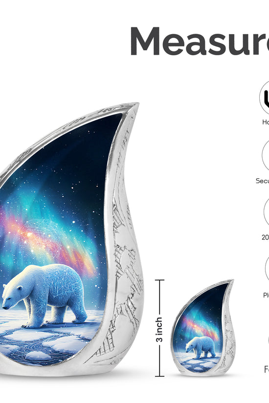 Sky Blue Bear Cremation Urn angled view of lid and engraved motif - flowing teardrop bear silhouette on curved aluminum - mini keepsake memorial for portion of cremation ashes