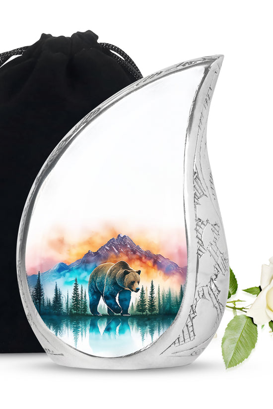 Gleaming Silver Bear Cremation Urn front view showing detailed design - flowing teardrop bear silhouette on curved aluminum - full-size 10 inch 200 cubic inch adult cremation urn