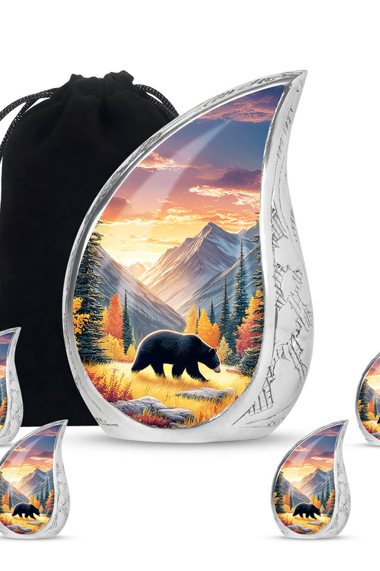 Sunrise Gold Bear Cremation Urn side profile showing urn shape - flowing teardrop bear silhouette on curved aluminum - memorial set with one large and four small urns