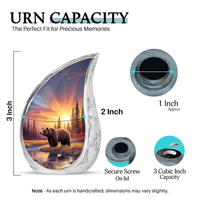 Burgundy Red Bear Cremation Urn angled view of lid and engraved motif - flowing teardrop bear silhouette on curved aluminum - mini keepsake memorial for portion of cremation ashes