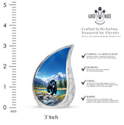 Cornflower Blue Bear Cremation Urn angled view of lid and engraved motif - smooth teardrop contour featuring bear art - mini keepsake memorial for portion of cremation ashes