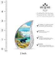 Tropical Teal Bear Cremation Urn angled view of lid and engraved motif - graceful tear-shaped urn with bear motif - mini keepsake memorial for portion of cremation ashes