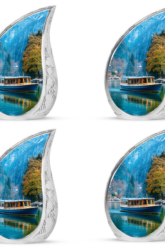 Dusty Blue Boat Cremation Urn close-up of engraving and surface detail - rounded teardrop boat design with delicate detail - 10 inch aluminum urn for cremated remains