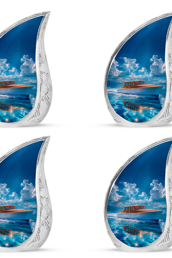 Steel Blue Boat Cremation Urn close-up of engraving and surface detail - smooth teardrop contour featuring boat art - 10 inch aluminum urn for cremated remains