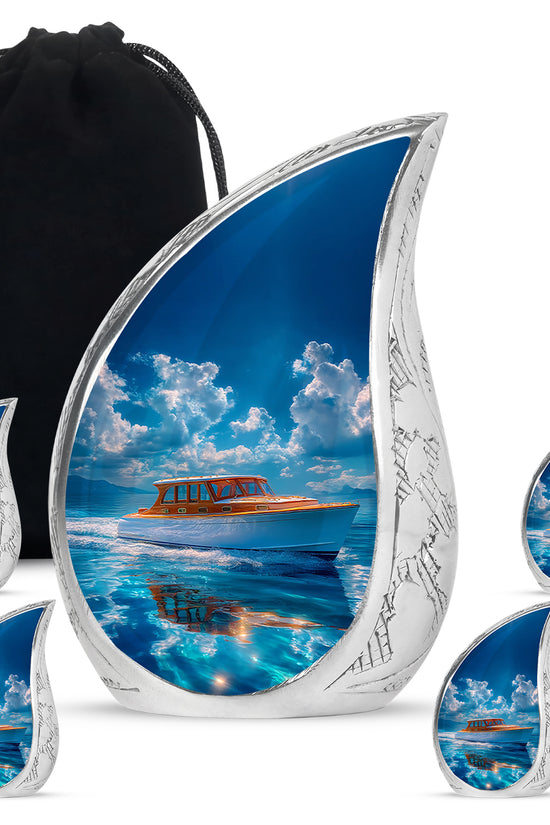 Calming Blue Boat Cremation Urn side profile showing urn shape - graceful tear-shaped urn with boat motif - memorial set with one large and four small urns
