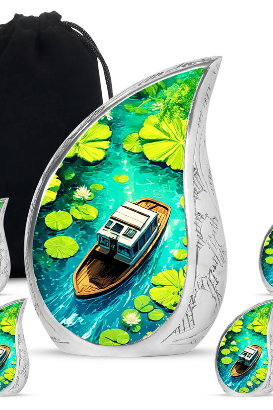 Azure Boat Cremation Urn side profile showing urn shape - rounded teardrop boat design with delicate detail - memorial set with one large and four small urns