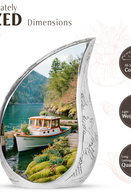 Ocean Teal Boat Cremation Urn angled view of lid and engraved motif - flowing teardrop boat silhouette on curved aluminum - mini keepsake memorial for portion of cremation ashes