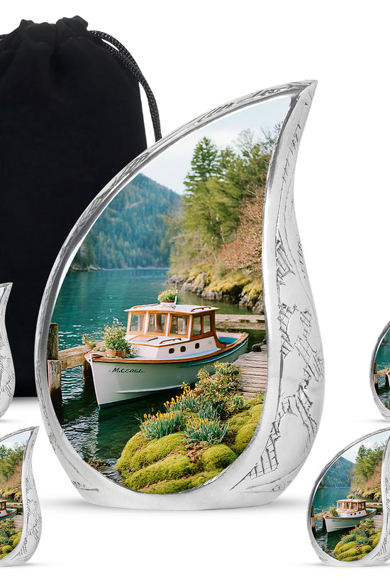 Vivid Teal Boat Cremation Urn side profile showing urn shape - smooth teardrop contour featuring boat art - memorial set with one large and four small urns