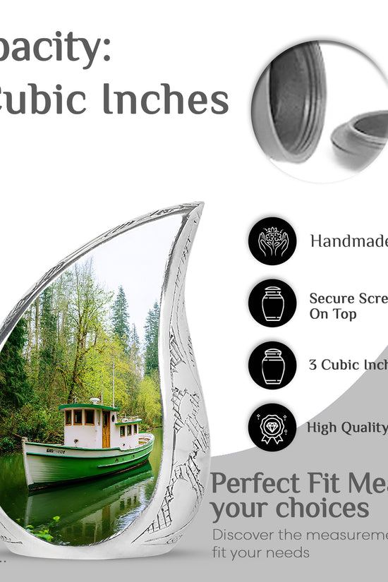 Pine Green Boat Cremation Urn angled view of lid and engraved motif - smooth teardrop contour featuring boat art - mini keepsake memorial for portion of cremation ashes