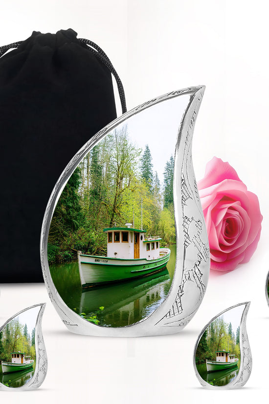 Verdant Green Boat Cremation Urn side profile showing urn shape - rounded teardrop boat design with delicate detail - memorial set with one large and four small urns
