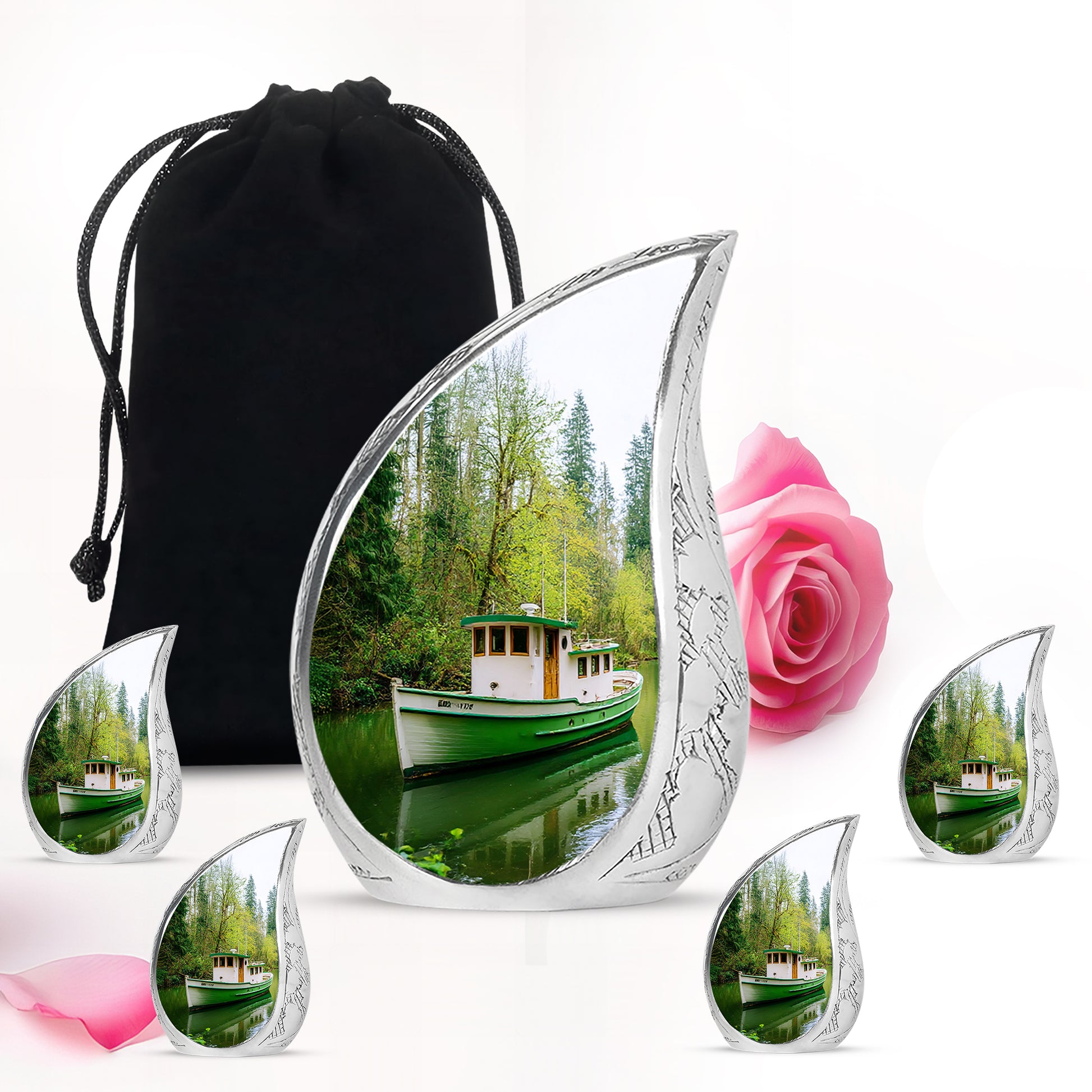 Verdant Green Boat Cremation Urn side profile showing urn shape - rounded teardrop boat design with delicate detail - memorial set with one large and four small urns