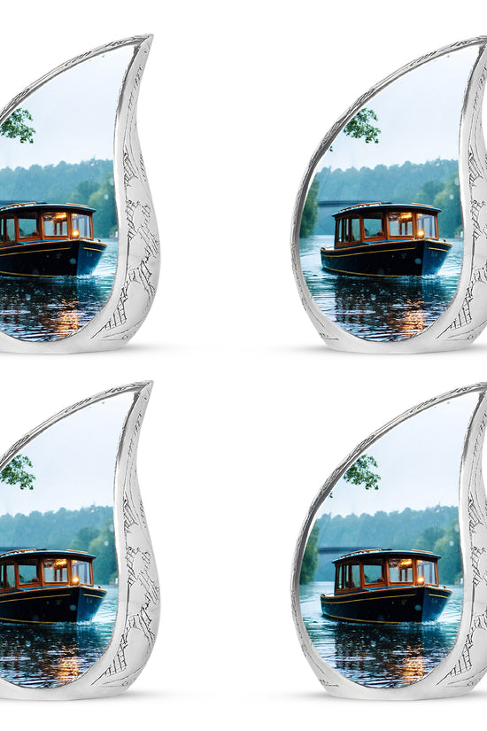 Cloud White Boat Cremation Urn close-up of engraving and surface detail - smooth teardrop contour featuring boat art - 10 inch aluminum urn for cremated remains