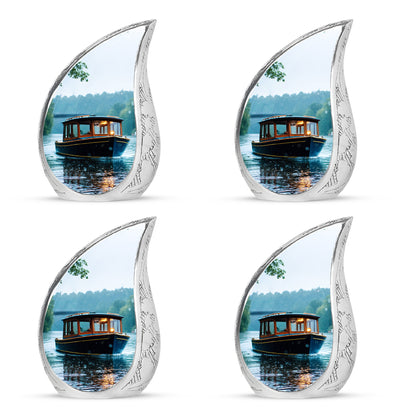 Cloud White Boat Cremation Urn close-up of engraving and surface detail - smooth teardrop contour featuring boat art - 10 inch aluminum urn for cremated remains