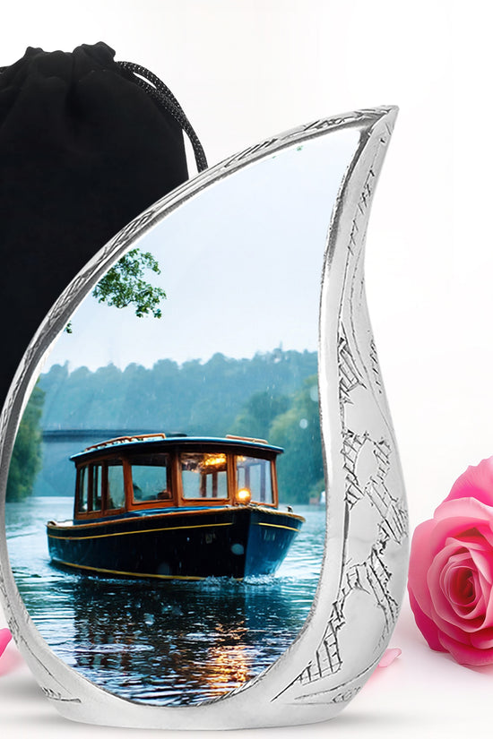 Cream White Boat Cremation Urn front view showing detailed design - graceful tear-shaped urn with boat motif - full-size 10 inch 200 cubic inch adult cremation urn