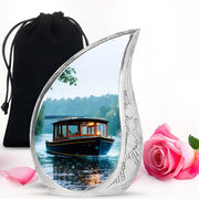 Cream White Boat Cremation Urn front view showing detailed design - graceful tear-shaped urn with boat motif - full-size 10 inch 200 cubic inch adult cremation urn