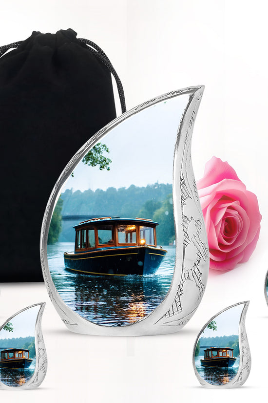 Silk White Boat Cremation Urn side profile showing urn shape - graceful tear-shaped urn with boat motif - memorial set with one large and four small urns