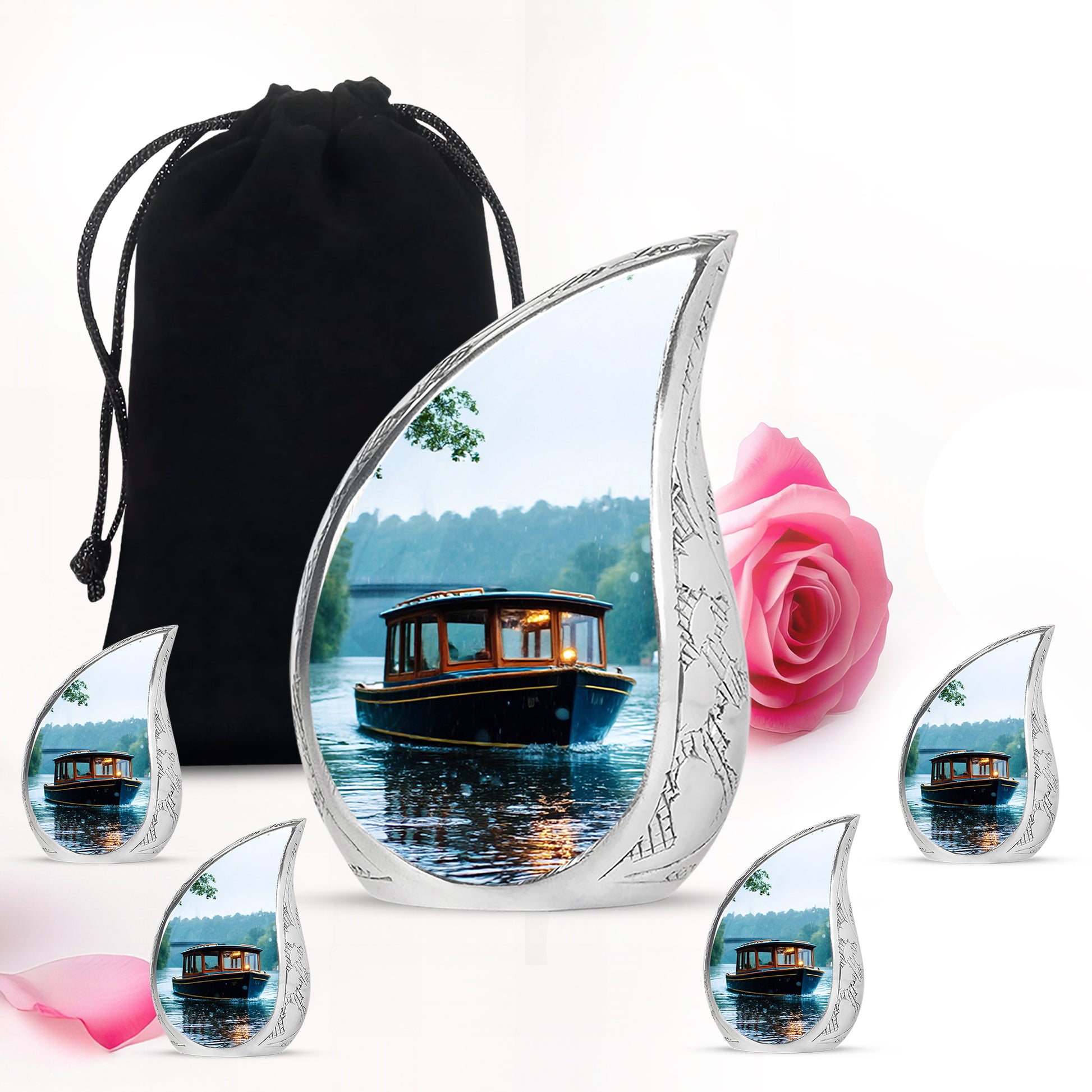 Silk White Boat Cremation Urn side profile showing urn shape - graceful tear-shaped urn with boat motif - memorial set with one large and four small urns