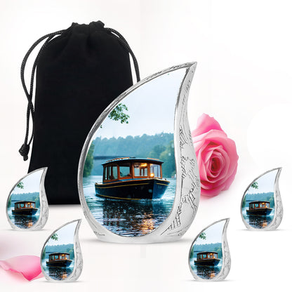 Silk White Boat Cremation Urn side profile showing urn shape - graceful tear-shaped urn with boat motif - memorial set with one large and four small urns