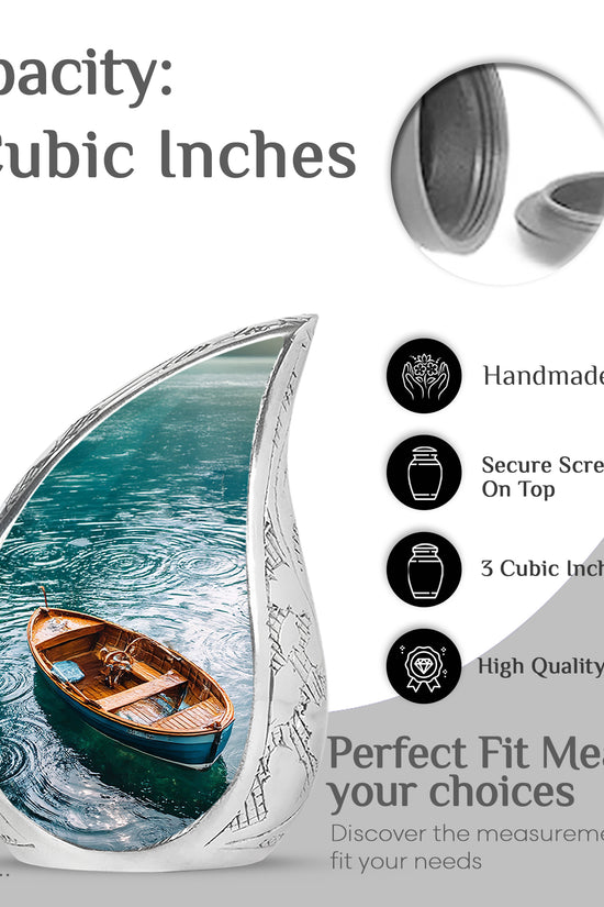 Soft Teal Boat Cremation Urn angled view of lid and engraved motif - flowing teardrop boat silhouette on curved aluminum - mini keepsake memorial for portion of cremation ashes