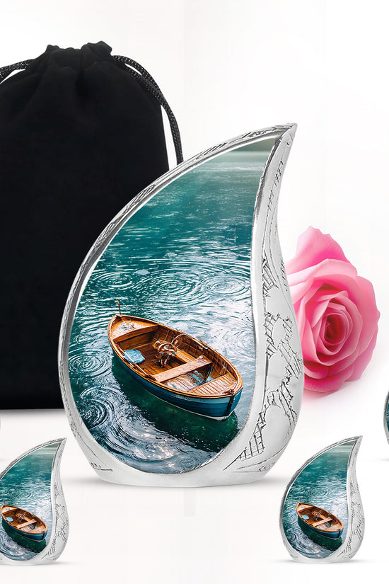 Deep Teal Boat Cremation Urn side profile showing urn shape - smooth teardrop contour featuring boat art - memorial set with one large and four small urns