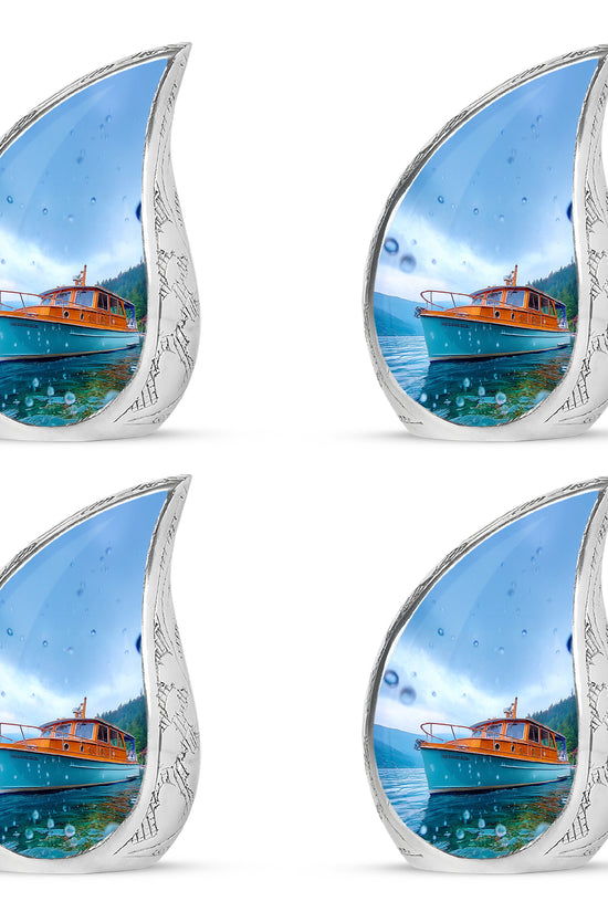Steel Blue Boat Cremation Urn close-up of engraving and surface detail - graceful tear-shaped urn with boat motif - 10 inch aluminum urn for cremated remains
