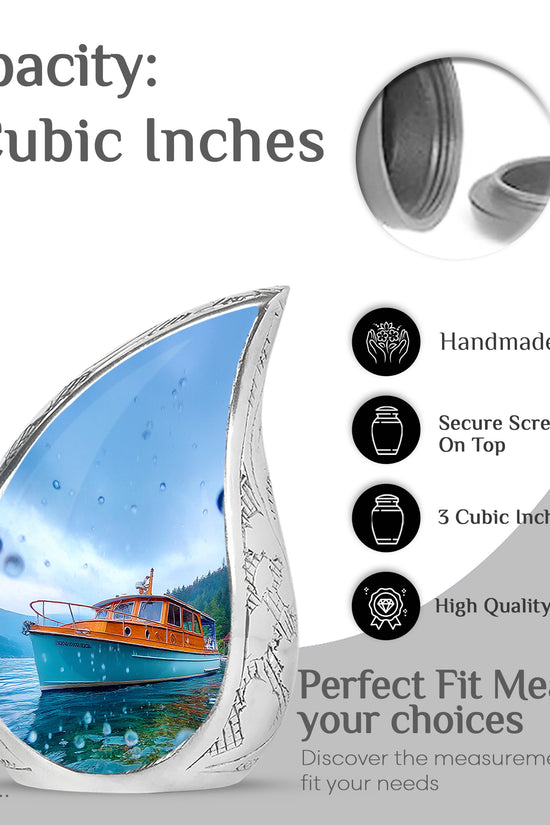 Sapphire Blue Boat Cremation Urn angled view of lid and engraved motif - graceful tear-shaped urn with boat motif - mini keepsake memorial for portion of cremation ashes