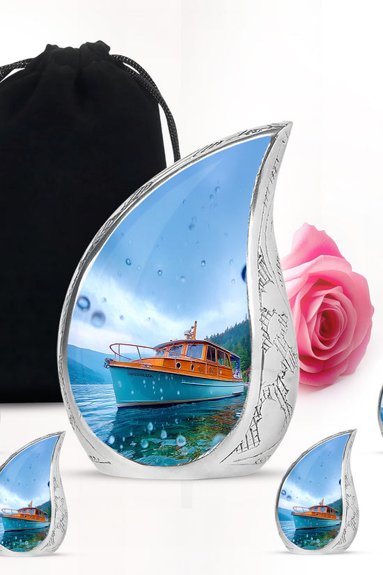 Cobalt Blue Boat Cremation Urn side profile showing urn shape - graceful tear-shaped urn with boat motif - memorial set with one large and four small urns